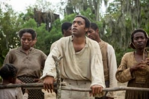 Chiwetel Ejiofor, center, stars in a scene from the movie "12 Years a Slave." The Catholic News Service classification is L -- limited adult audience, films whose problematic content many adults would find troubling. The Motion Picture Association of America rating is R -- restricted. Under 17 requires accompanying parent or adult guardian. (CNS photo/Fox Searchlight) (Nov. 20, 2013) See MOVIE REVIEW Nov. 20, 2013.